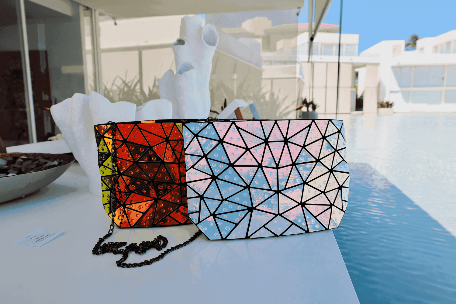 GeoBags | Beautiful geometric tote handbag with water drop effect detail throughout the bag reflecting an explosion of spectrum colors, and outfitted with a polished drop-in shoulder chain. Fun for any occasion.